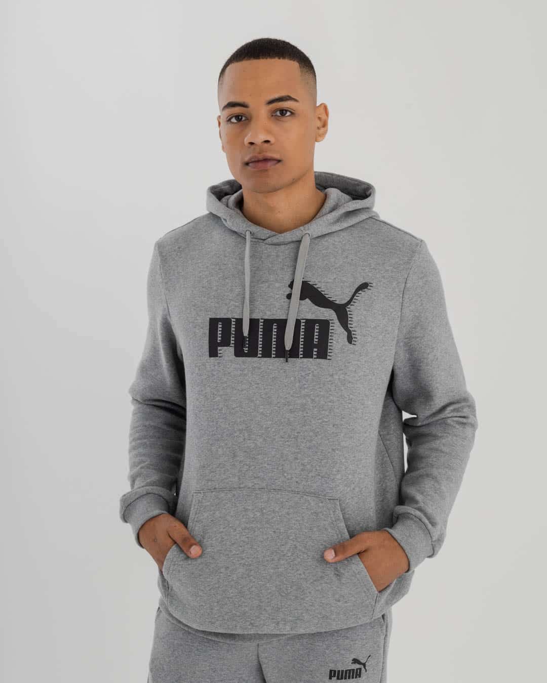 man wearing Puma Hoodie with Puma logo on chest,