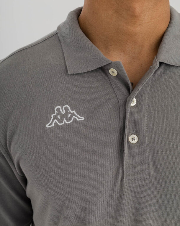 close up shot of man wearing grey Kappa golfer with Kappa Logo in white on right side