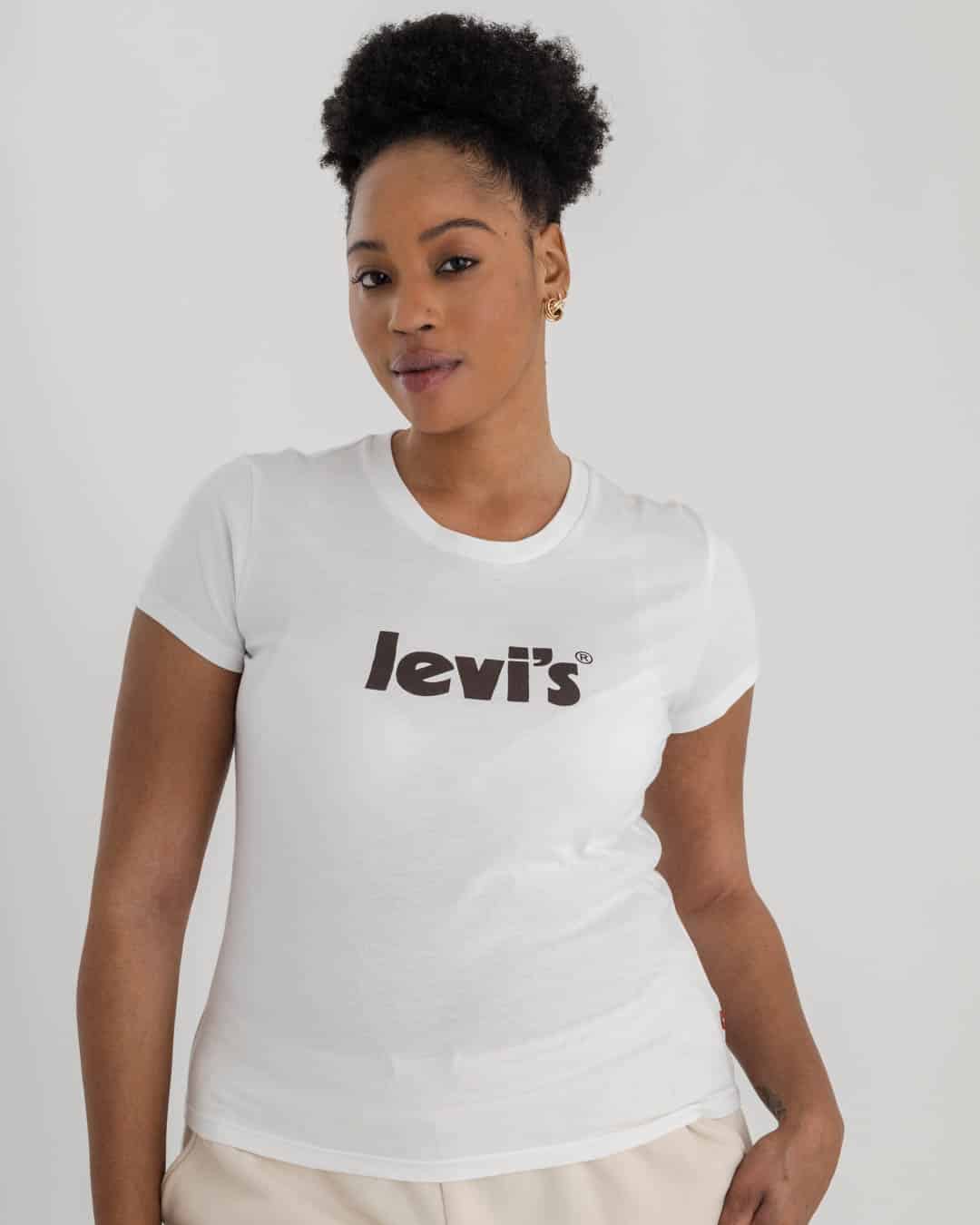 mid shot of woman wearing white Levi's t-shirt with Levi's logo on chest in black