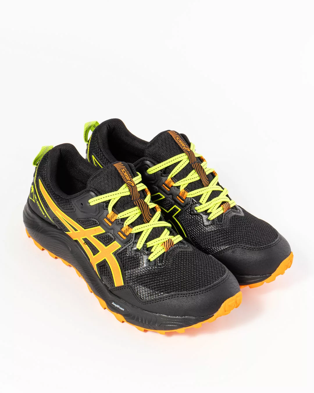 side profile of men's asics trainers in black and bright orange with bright orange laces and asics logo on vamp in bright orange