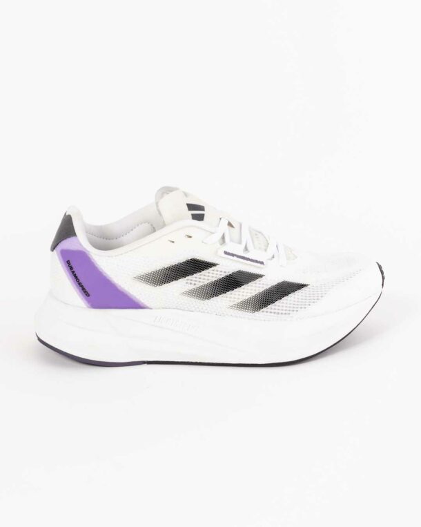 ladies white Adidas trainers with Adidas 3 stripe paneling in ombre black on upper and purple paneling in purple with Duramo speed embossed, adidas 3 stripe logo on tongue