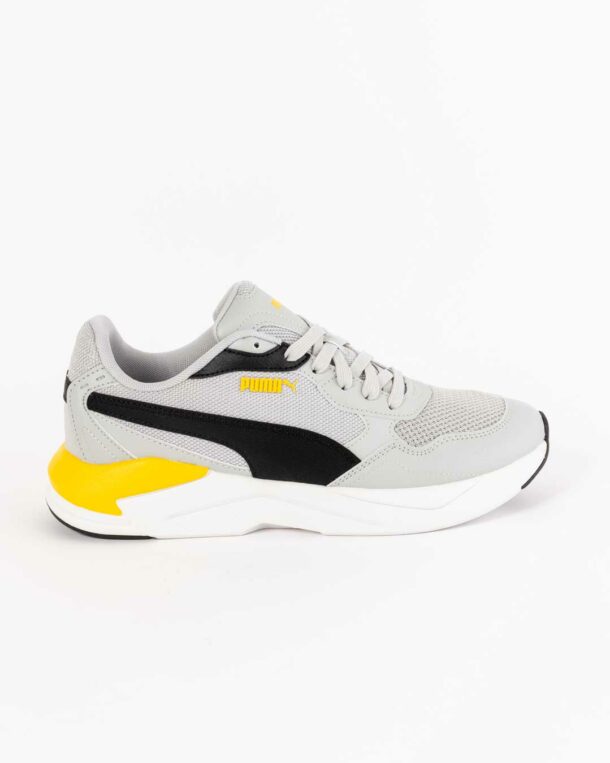 side shot of children's Junior sneaker in grey with black and yellow paneling and white midsole