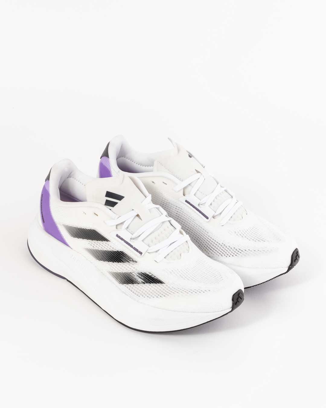 side angled shot of women's white 3 stripe paneling in ombre black on upper and purple paneling in purple with Duramo speed embossed, adidas 3 stripe logo on tongue
